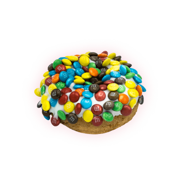 A Naughti Donut finished with white glaze and a dense crown of colorful candy shells